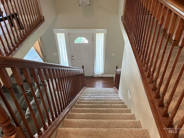 11565 W Zachery Ave, Nampa, ID 83651 - staircase with wood finished floors, baseboards, and a high ceiling
