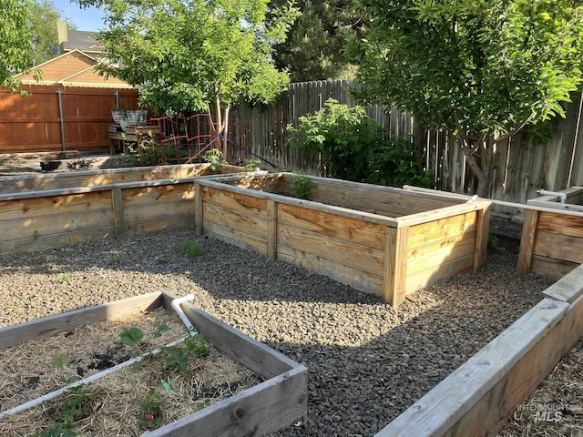 11565 W Zachery Ave, Nampa, ID 83651 - fenced backyard with a vegetable garden
