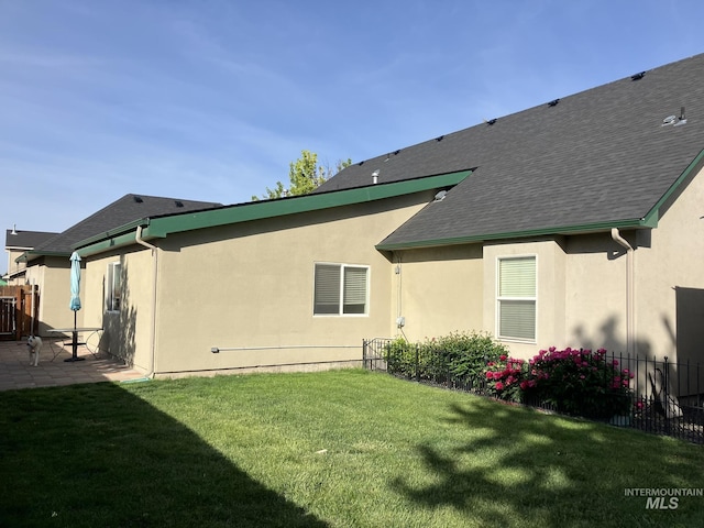 11565 W Zachery Ave, Nampa, ID 83651 - rear view of property with a patio, stucco siding, and a shingled roof