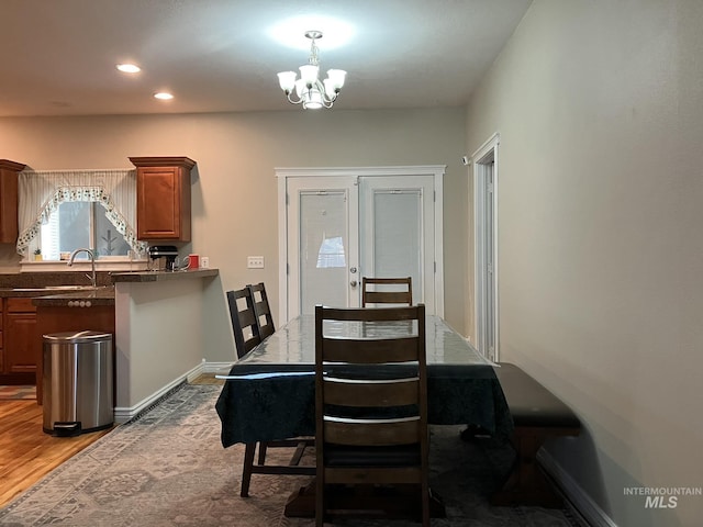 11565 W Zachery Ave, Nampa, ID 83651 - dining room featuring a chandelier, wood finished floors, baseboards, and recessed lighting