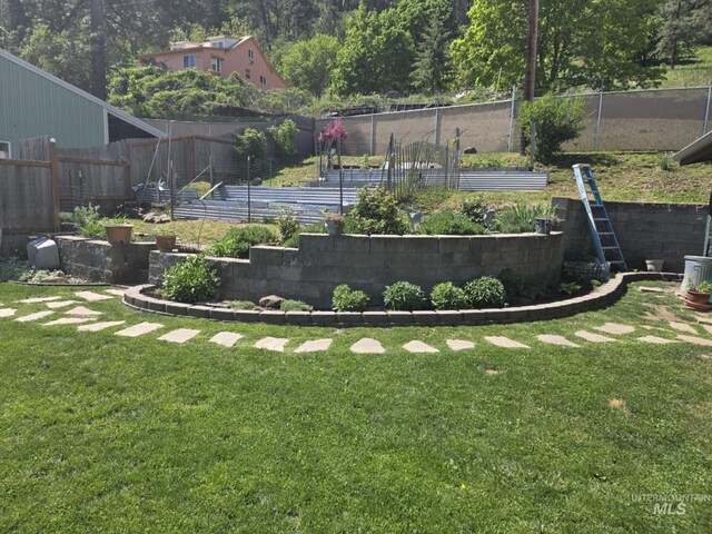 415 W Howard St, Peck, ID 83545 - view of yard featuring a vegetable garden