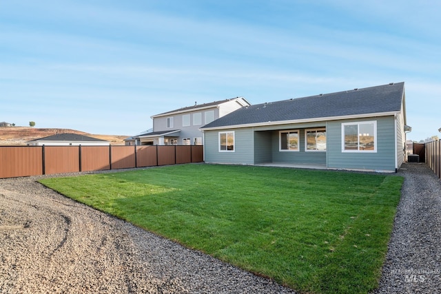 2267 W Blue Lightning Ct, Middleton, ID 83644 - rear view of house with a patio area, central AC unit, and roof with shingles
