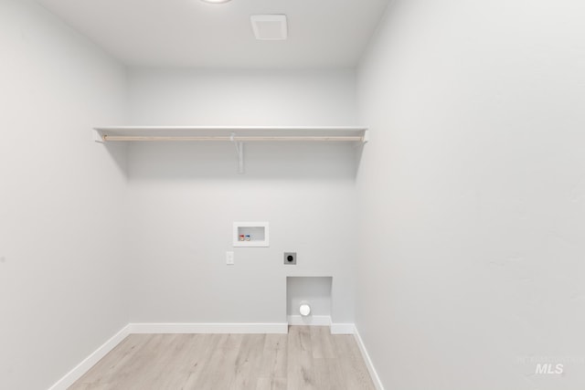 2351 W Opalite Dr, Kuna, ID 83634 - washroom featuring washer hookup, electric dryer hookup, light wood-style flooring, and baseboards