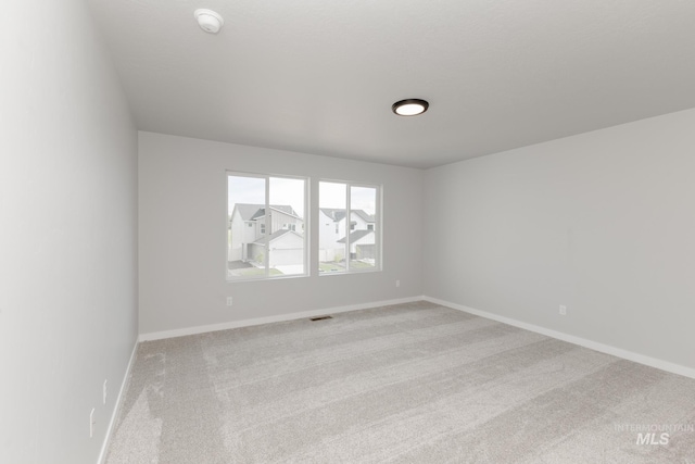 2351 W Opalite Dr, Kuna, ID 83634 - unfurnished room featuring light colored carpet, a smoke detector, and baseboards