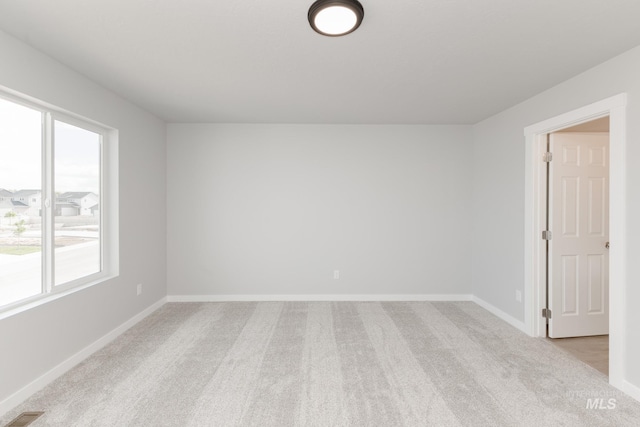 2351 W Opalite Dr, Kuna, ID 83634 - spare room with light carpet, plenty of natural light, and baseboards