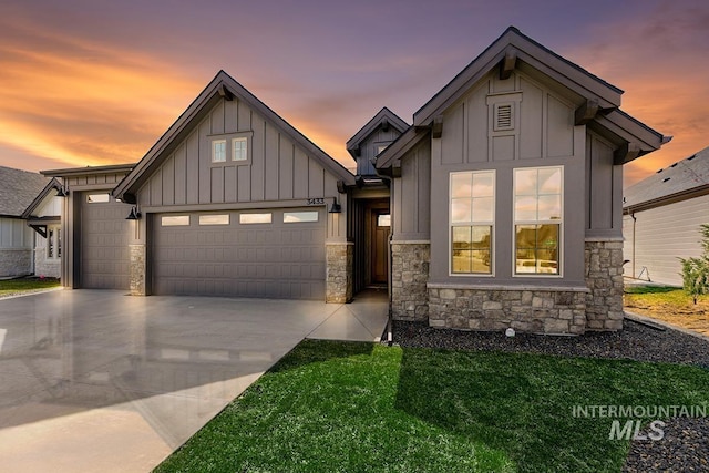 7029 S Tindaris Ave, Meridian, ID 83642 - view of front facade featuring board and batten siding, a garage, stone siding, driveway, and a front yard