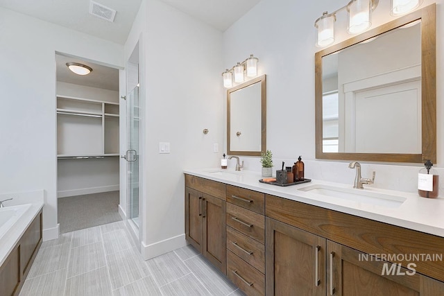 7029 S Tindaris Ave, Meridian, ID 83642 - bathroom with double vanity, a shower stall, a tub, and a walk in closet
