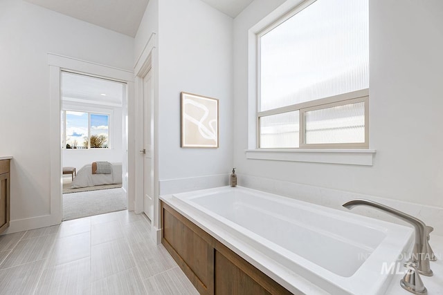 7029 S Tindaris Ave, Meridian, ID 83642 - ensuite bathroom with a bath and vanity