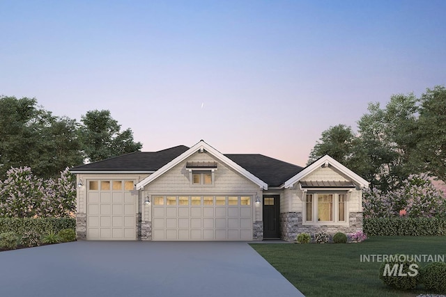 7029 S Tindaris Ave, Meridian, ID 83642 - view of front of house featuring stone siding, an attached garage, a front yard, and concrete driveway