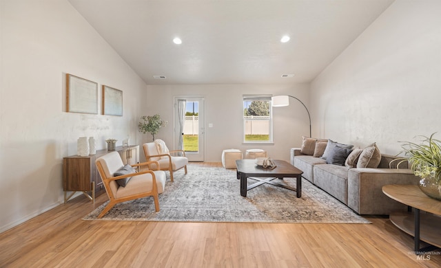 4064 N Alester Ave, Meridian, ID 83646 - living room featuring light wood-type flooring, vaulted ceiling, recessed lighting, and baseboards
