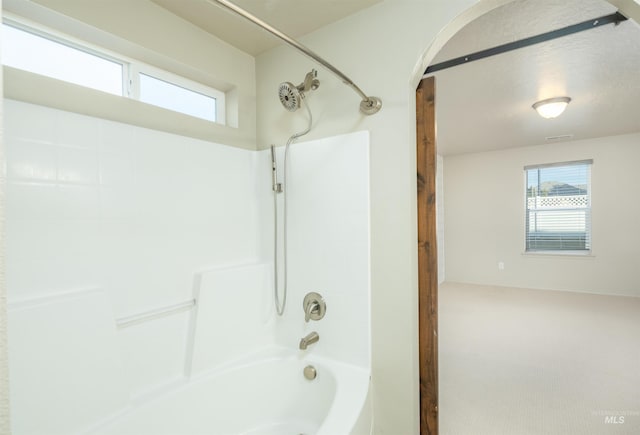 bathroom with tub / shower combination
