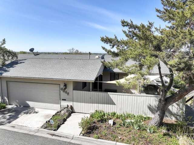 4845 N Wildrye, Boise, ID 83703 - view of front of house with roof with shingles, driveway, and an attached garage