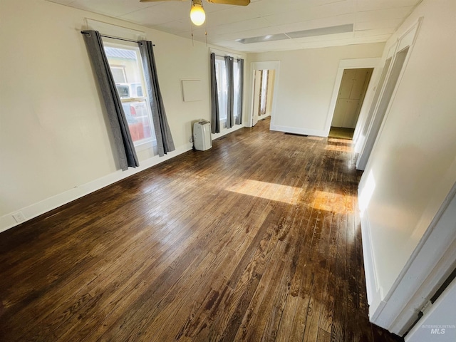 spare room featuring dark hardwood / wood-style floors and ceiling fan