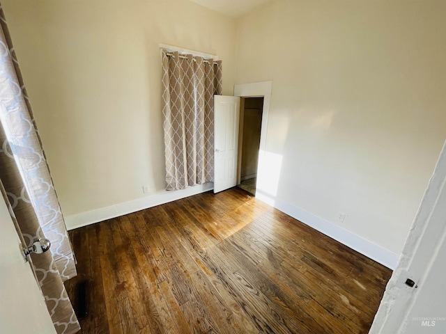 spare room featuring hardwood / wood-style floors