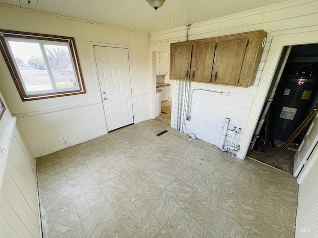 laundry room with electric water heater