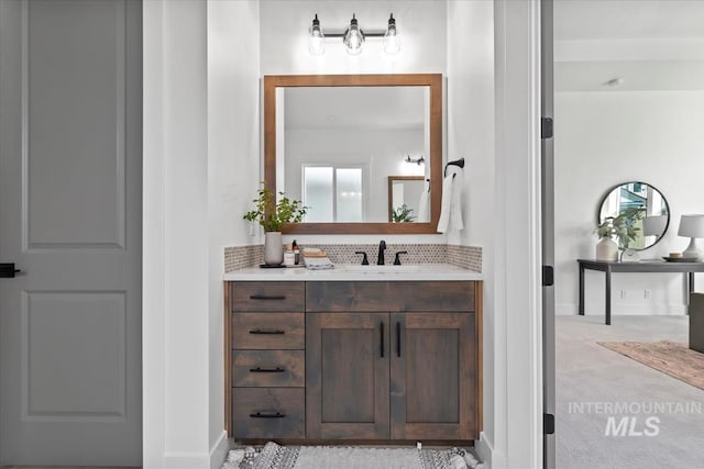 bathroom featuring vanity and baseboards