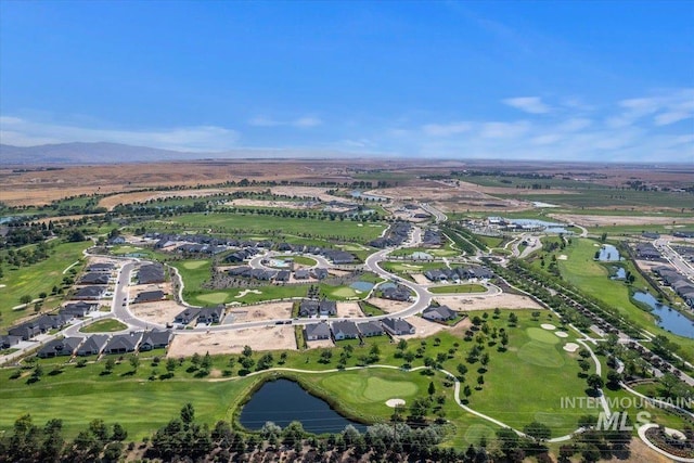 bird's eye view featuring a water view and golf course view