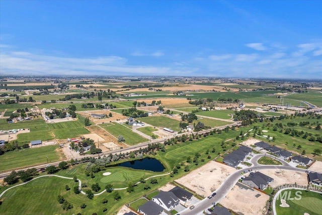 birds eye view of property with a water view and a rural view