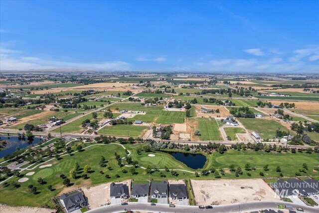 aerial view with a rural view and a water view