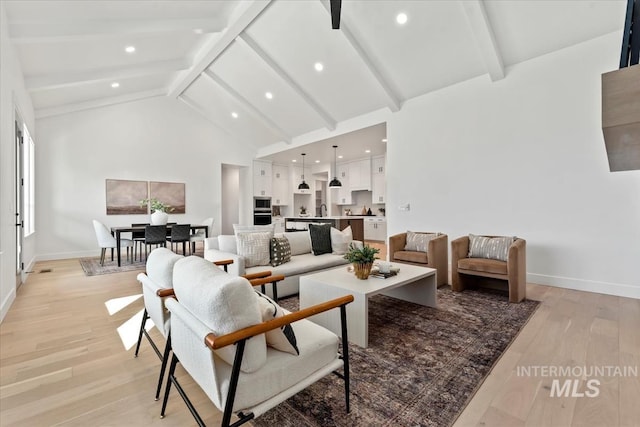 living area with beamed ceiling, high vaulted ceiling, recessed lighting, light wood-style floors, and baseboards