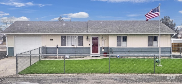 ranch-style house featuring a garage and a front lawn