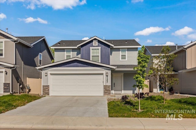 view of front of property featuring board and batten siding, stone siding, driveway, and a garage