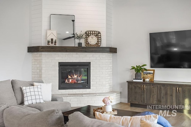 5445 S Mesa Trail Pl, Meridian, ID 83642 - living area featuring wood finished floors and a fireplace