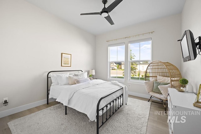 5445 S Mesa Trail Pl, Meridian, ID 83642 - bedroom featuring light wood-type flooring, baseboards, and a ceiling fan