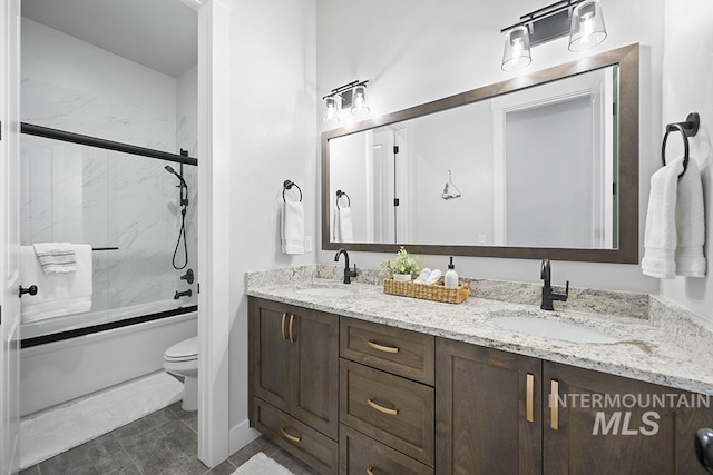 5445 S Mesa Trail Pl, Meridian, ID 83642 - bathroom with double vanity, toilet, enclosed tub / shower combo, and tile patterned flooring