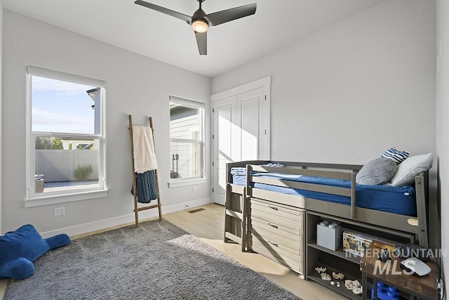 5445 S Mesa Trail Pl, Meridian, ID 83642 - bedroom featuring baseboards, ceiling fan, and light wood-style flooring