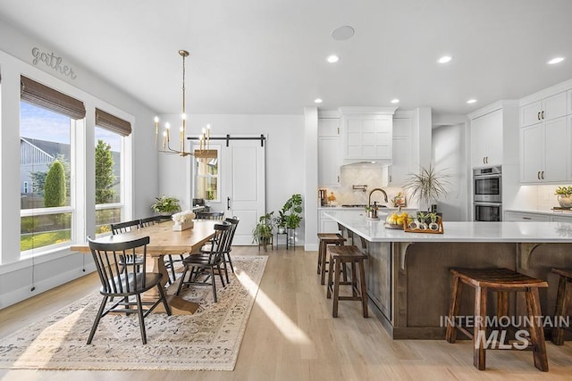 5445 S Mesa Trail Pl, Meridian, ID 83642 - dining room featuring recessed lighting, light wood-type flooring, a chandelier, and baseboards