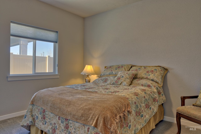 carpeted bedroom with baseboards