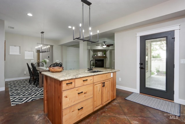 570 E Ocelot, Meridian, ID 83646 - kitchen featuring a sink, baseboards, a ceiling fan, open floor plan, and recessed lighting