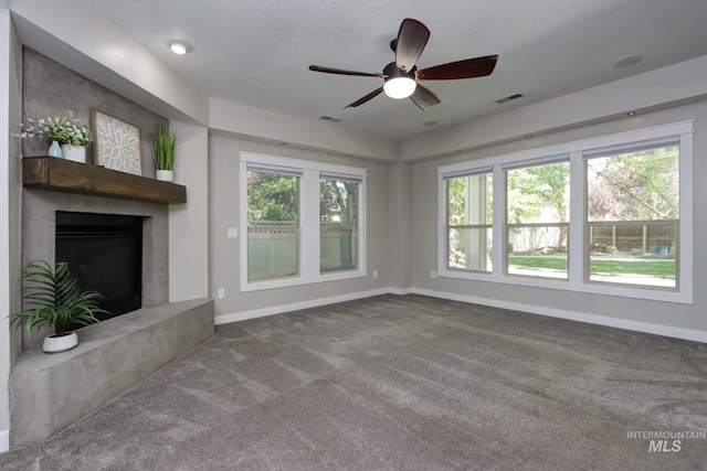 570 E Ocelot, Meridian, ID 83646 - unfurnished living room featuring baseboards, a ceiling fan, carpet flooring, and a high end fireplace