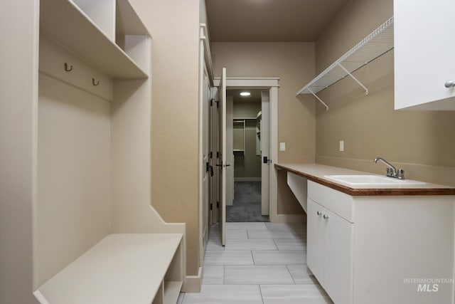 570 E Ocelot, Meridian, ID 83646 - laundry area featuring a sink and light tile patterned floors