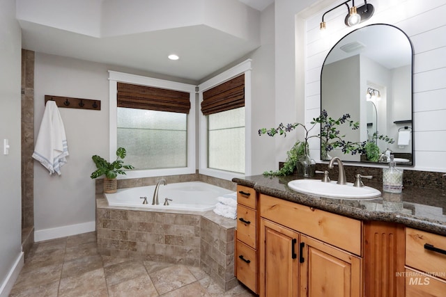 570 E Ocelot, Meridian, ID 83646 - full bath with a garden tub, baseboards, vanity, and recessed lighting