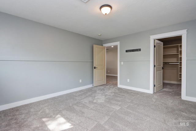 570 E Ocelot, Meridian, ID 83646 - unfurnished bedroom with carpet flooring, a spacious closet, baseboards, and a closet