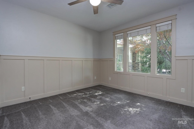 570 E Ocelot, Meridian, ID 83646 - carpeted empty room featuring a decorative wall, a ceiling fan, and wainscoting