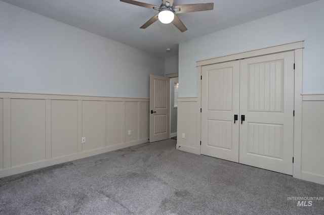 570 E Ocelot, Meridian, ID 83646 - unfurnished bedroom featuring carpet floors, wainscoting, a closet, a decorative wall, and a ceiling fan