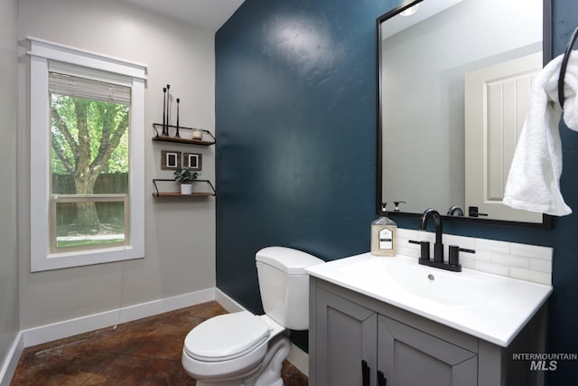 570 E Ocelot, Meridian, ID 83646 - half bath with toilet, baseboards, backsplash, and vanity