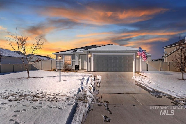 ranch-style home featuring a garage