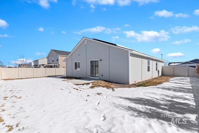 view of snow covered house