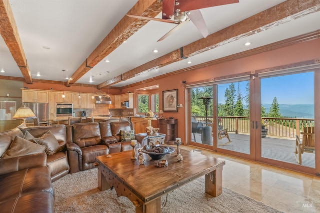 living room with beamed ceiling, recessed lighting, ornamental molding, a mountain view, and ceiling fan