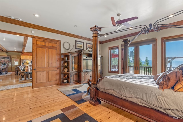 bedroom with access to exterior, recessed lighting, wood finished floors, and crown molding
