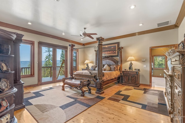 bedroom with access to exterior, recessed lighting, crown molding, baseboards, and wood-type flooring