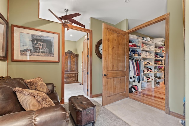 sitting room with light tile patterned floors, ceiling fan, recessed lighting, and baseboards