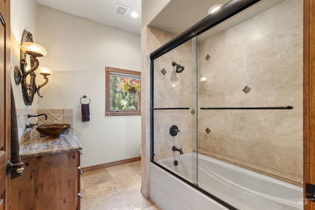 bathroom featuring baseboards, enclosed tub / shower combo, vanity, and tasteful backsplash