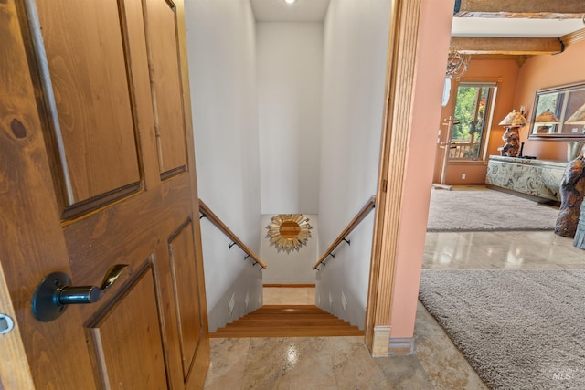 stairway with baseboards and marble finish flooring