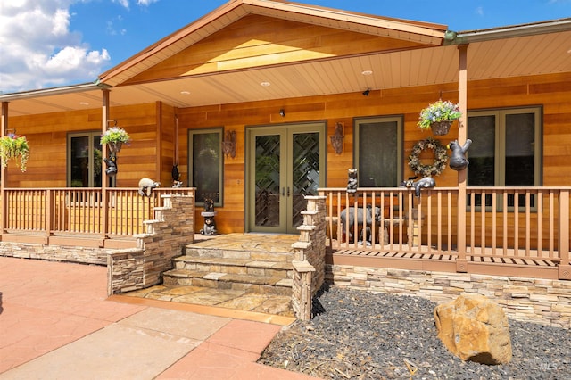 view of front of property with french doors and covered porch