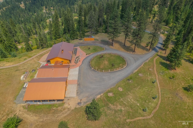 aerial view of property's location with a forest